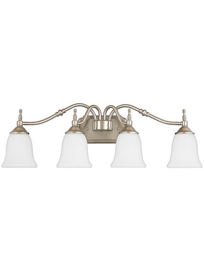 Tritan 4 Light Sconce With Opal Glass Shades in Brushed Nickel.